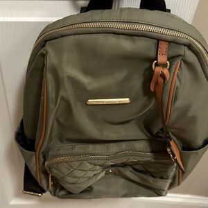Pre owned. Used around 3 times!  Back pack-like new condition!